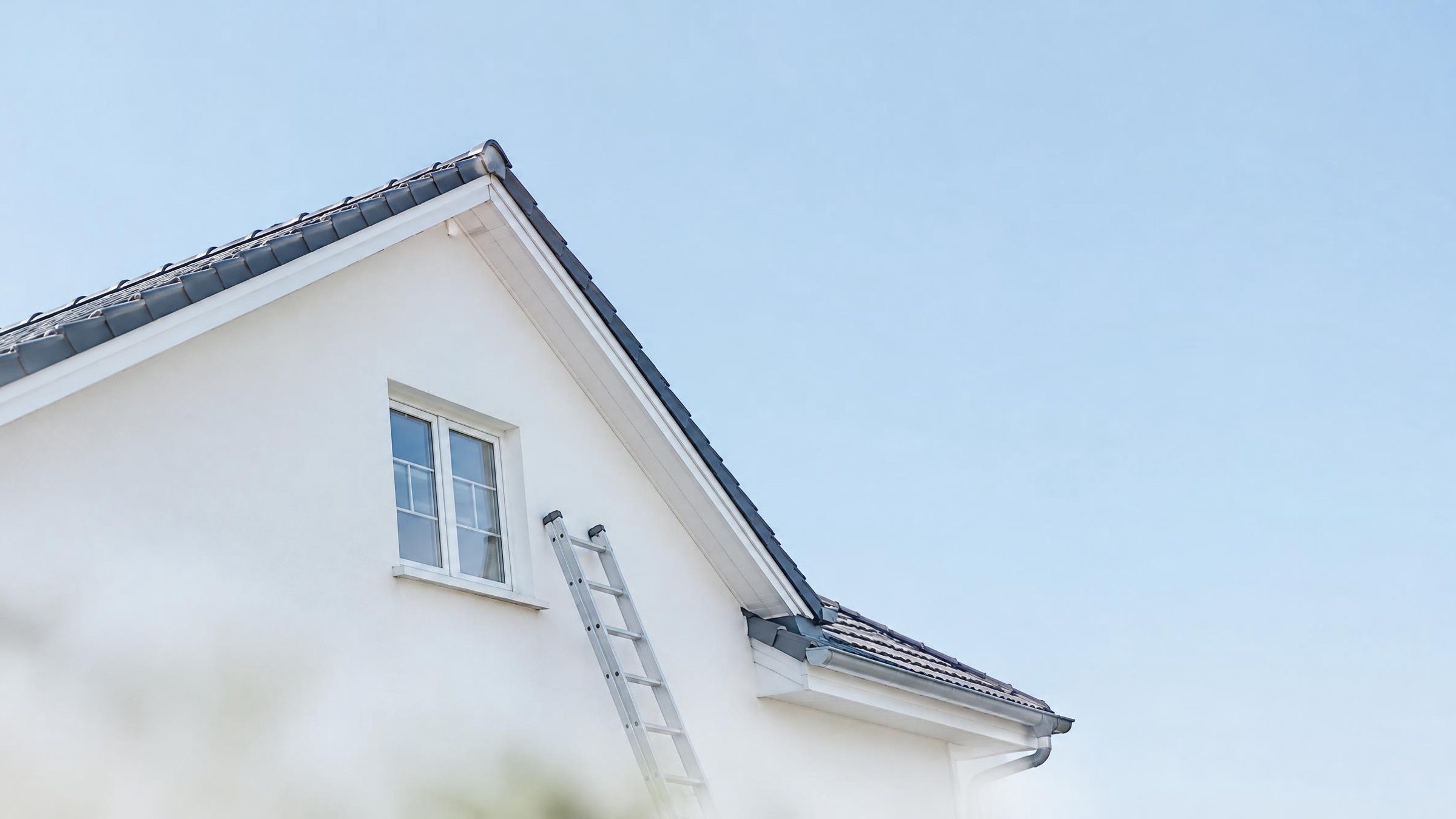 Technician carrying out maintenance on a building roof